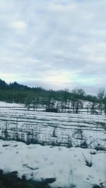 Scenic view of snow field against sky