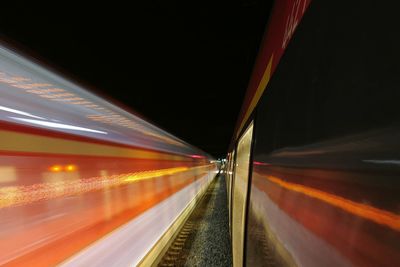 Light trails on train at night