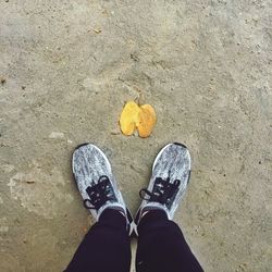 Low section of woman standing on tiled floor