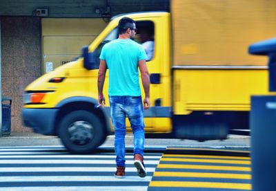 Blurred motion of people walking on street