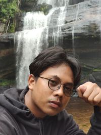 Portrait of young man wearing eyeglasses