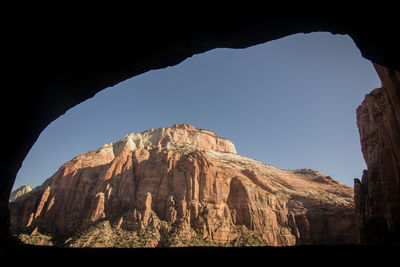 Low angle view of rock formation against sky