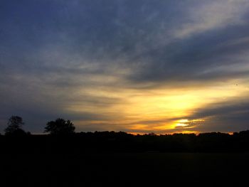Silhouette landscape against scenic sky