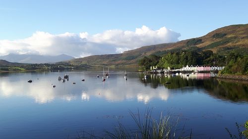 Scenic view of lake and mountains against sky