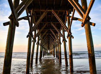 Pier over sea against sky