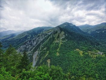 Scenic view of landscape against cloudy sky