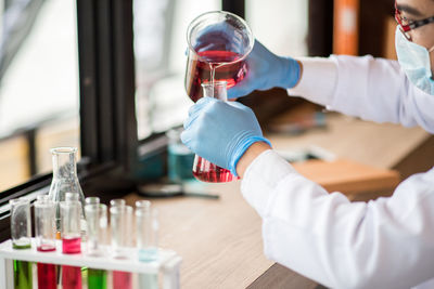 Man performing experiment in laboratory