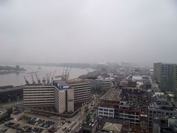 High angle view of buildings in city against sky