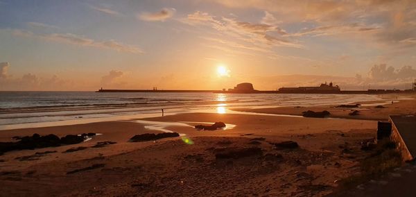 Scenic view of beach during sunset