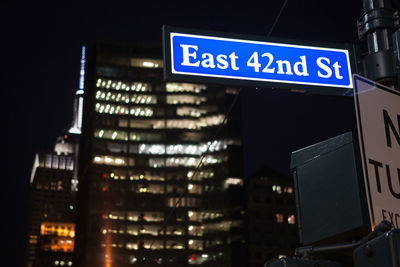 Low angle view of illuminated building at night