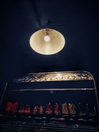 Close-up of illuminated candles on table