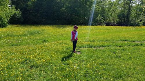 Full length of woman walking on field