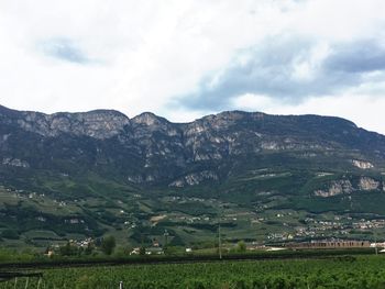 Scenic view of mountains against cloudy sky