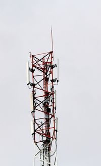 Low angle view of communications tower against sky