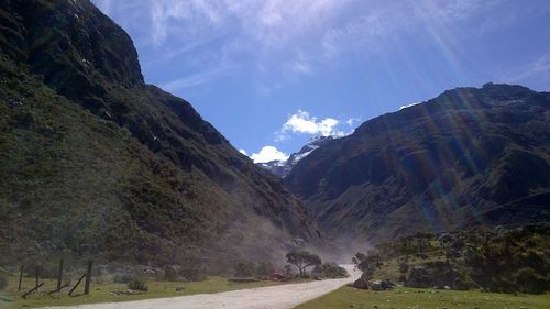 Country road along rocky mountains