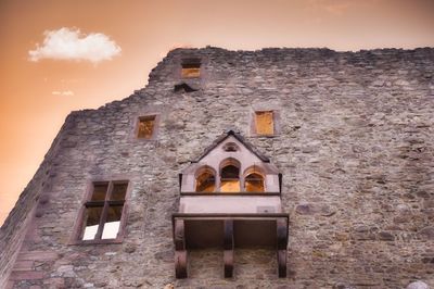 Low angle view of old building against sky