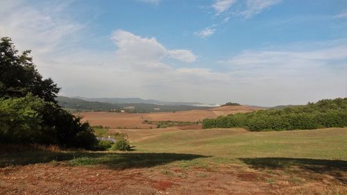 Landscape with mountain range in background