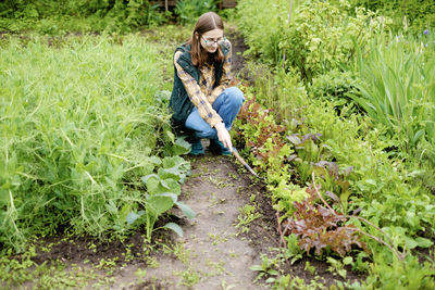 Woman standing in grass