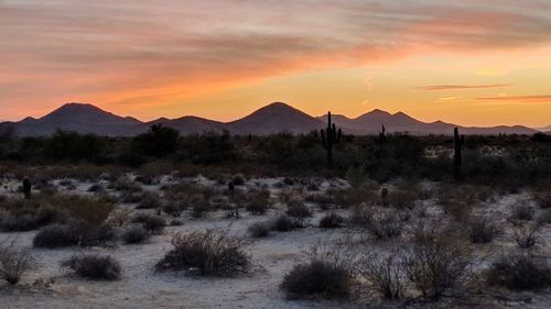 Scenic view of mountains against sky during sunset
