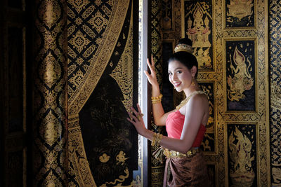 Smiling young woman in traditional clothing