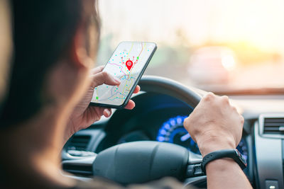 Midsection of woman using mobile phone