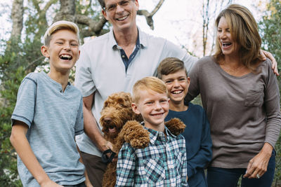 Happy family with irish wolfhound at park