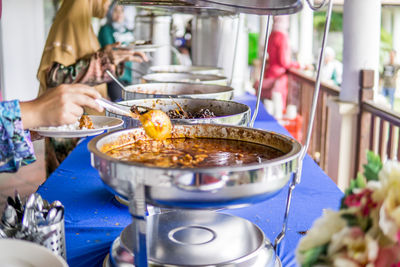 Close-up of man preparing food