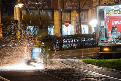 Illuminated lights seen through wet glass at night