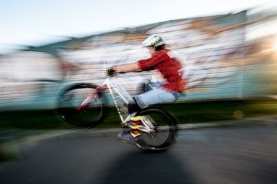 Blurred motion of people on road