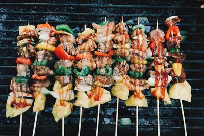 Close-up of meat and vegetables on barbecue grill