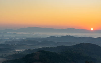 Scenic view of mountains against sky during sunset