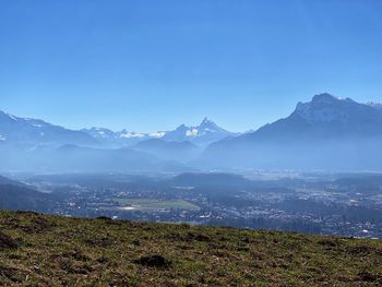 Scenic view of mountains against clear blue sky