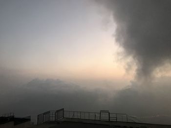 Scenic view of silhouette mountains against sky at sunset