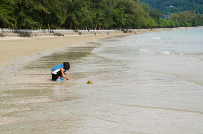 Man playing at beach