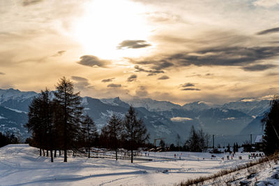 Scenic view of snow covered mountains against sky