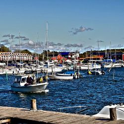 Boats moored at harbor