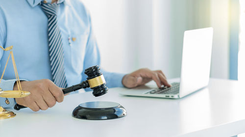 Man using laptop on table