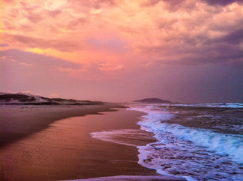 Scenic view of sea against cloudy sky