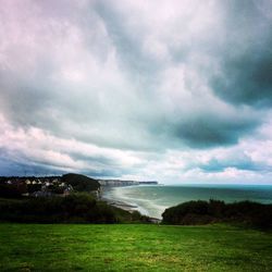 Scenic view of sea against cloudy sky