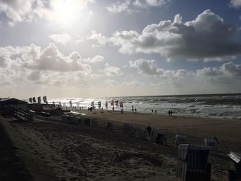 View of beach against cloudy sky