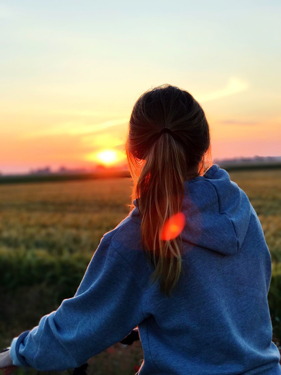 sunset, nature, real people, one person, orange color, field, sky, outdoors, leisure activity, beauty in nature, tranquility, scenics, lifestyles, landscape, childhood, day, people