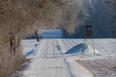 Road amidst snow covered land