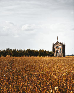 Church on field against sky