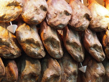 Full frame shot of  hams for sale at market stall