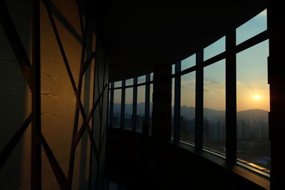 Scenic view of sunset seen through window