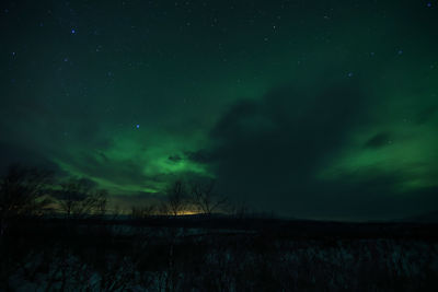 Scenic view of landscape against sky at night