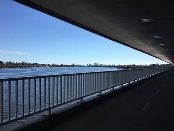 Bridge over river against blue sky