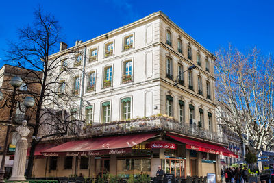 Low angle view of building against blue sky