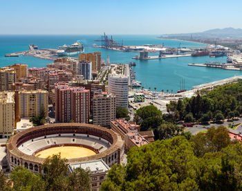 Aerial view of buildings and stadium in city