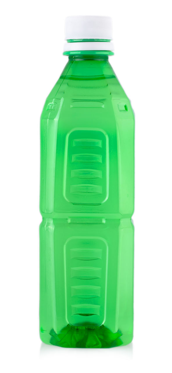 CLOSE-UP OF GREEN BOTTLE ON WHITE BACKGROUND